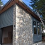 Teal Siding and Stone Home