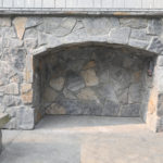Outdoor Arched Stone Fireplace