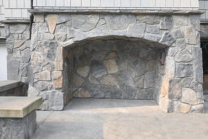Outdoor Arched Stone Fireplace
