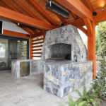 Luxury Outdoor Stone Kitchen with Red Cedar